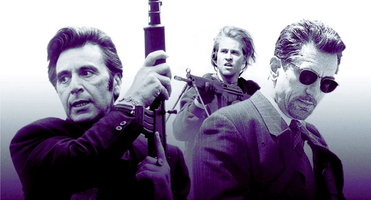 Cena do filme Fogo Contra Fogo (1995) com três homens em ação: dois segurando armas de fogo e um usando óculos escuros em ambiente urbano.